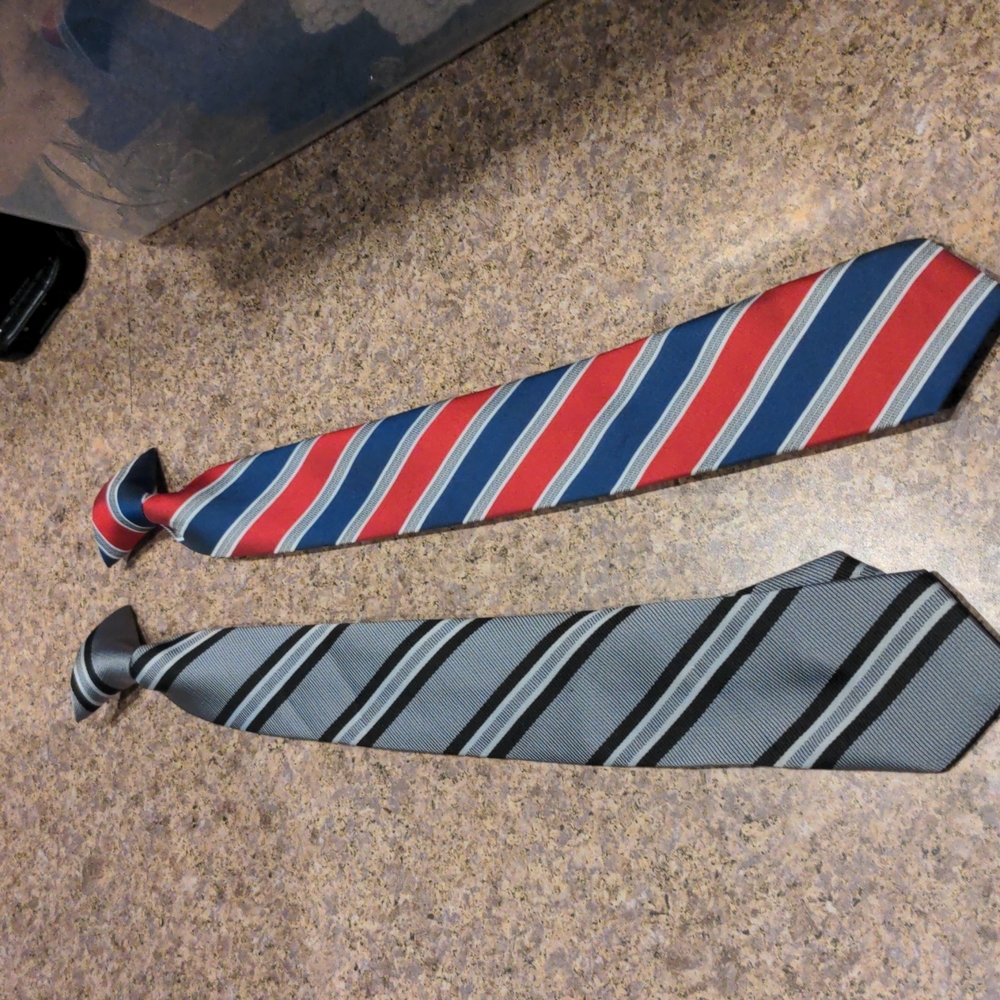 2 boys clip on ties. Excellent condition. Never worn.